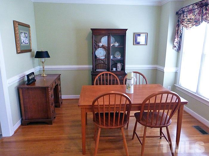 4807 Sinclair Drive Raleigh, NC 27616 - Photo 2 of 25 a view of a dining room with furniture and window