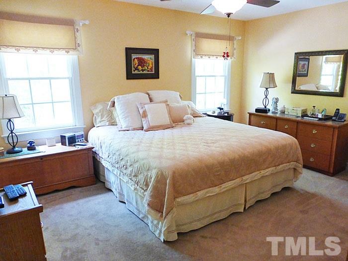 4807 Sinclair Drive Raleigh, NC 27616 - Photo 12 of 25 a bedroom with a bed and window