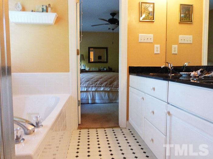 4807 Sinclair Drive Raleigh, NC 27616 - Photo 13 of 25 a bathroom with a bathtub and a sink