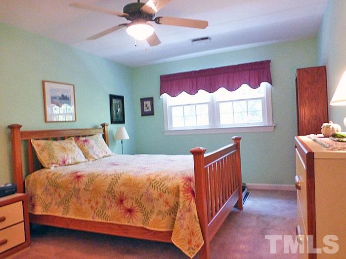 4807 Sinclair Drive Raleigh, NC 27616 - Photo 14 of 25 a bedroom with a bed and window