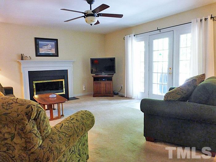 4807 Sinclair Drive Raleigh, NC 27616 - Photo 3 of 25 a living room with furniture and a fireplace
