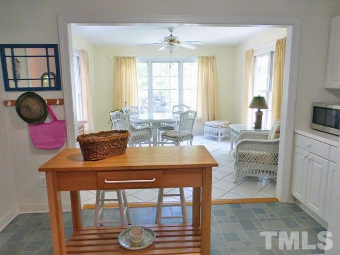 4807 Sinclair Drive Raleigh, NC 27616 - Photo 7 of 25 a view of a dining room with furniture and chandelier