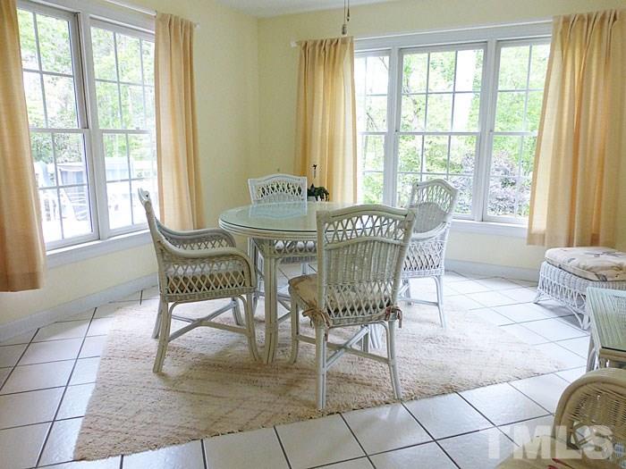 4807 Sinclair Drive Raleigh, NC 27616 - Photo 9 of 25 a dining room with furniture and windows
