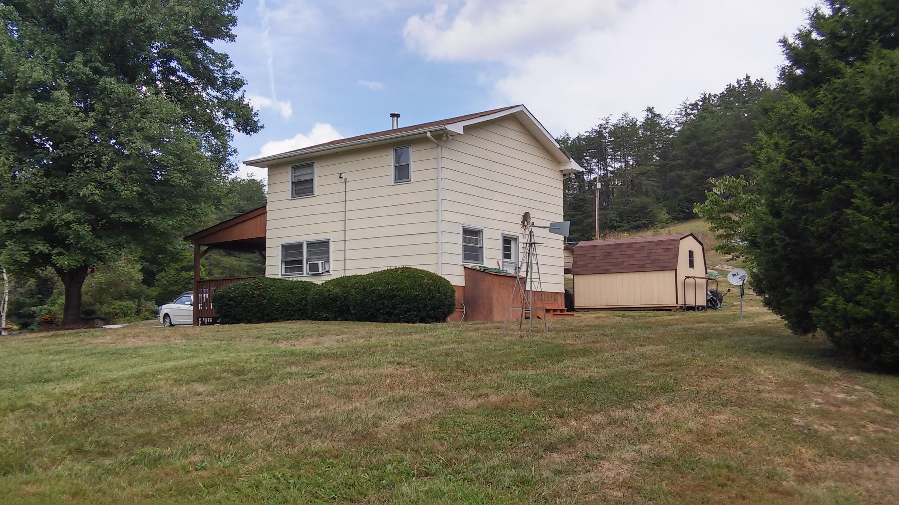 1990 Reesedale Road Elliston, VA 24087 - Photo 1 of 24 a view of a house with a yard