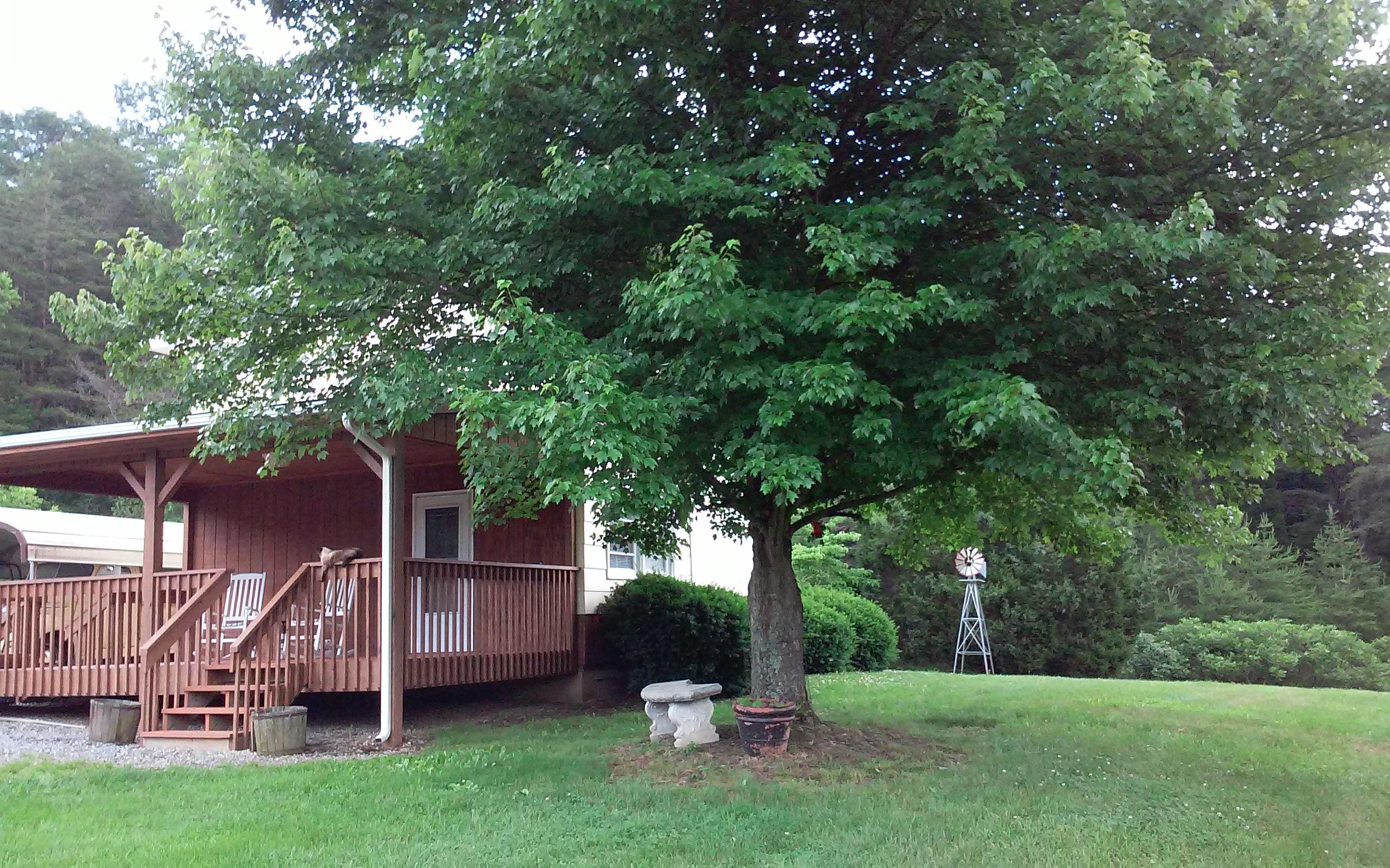 1990 Reesedale Road Elliston, VA 24087 - Photo 2 of 24 a view of a house with backyard and a tree