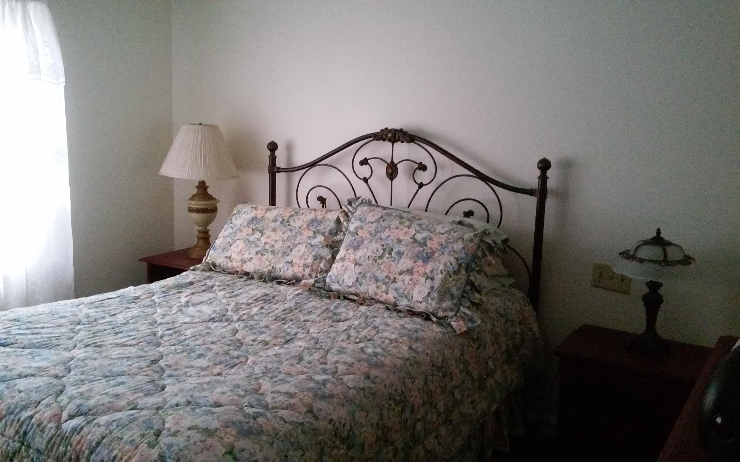 1990 Reesedale Road Elliston, VA 24087 - Photo 16 of 24 a bedroom with a bed and a night stand