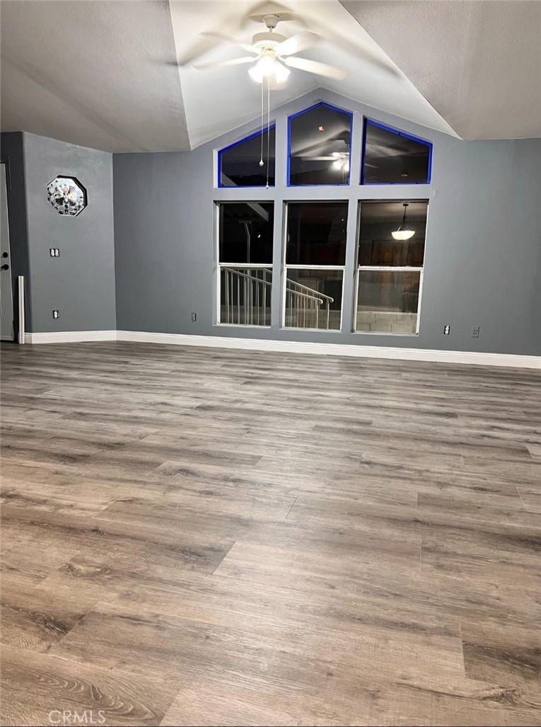 3700 Quartz Canyon Road, Unit 21 Jurupa Valley, CA 92508 - Photo 11 of 11 a view of an empty room with wooden floor and windows