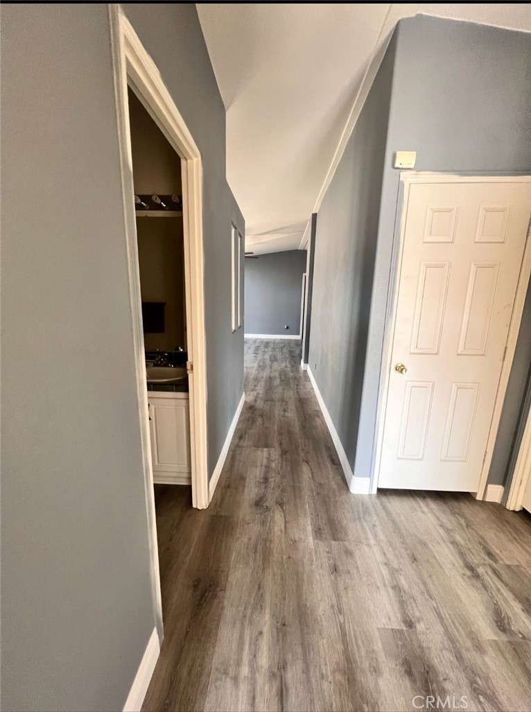 3700 Quartz Canyon Road, Unit 21 Jurupa Valley, CA 92508 - Photo 4 of 11 a view of a hallway with wooden floor and closet