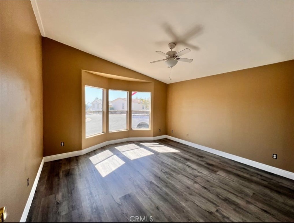 3700 Quartz Canyon Road, Unit 21 Jurupa Valley, CA 92508 - Photo 5 of 11 wooden floor in an empty room with a window