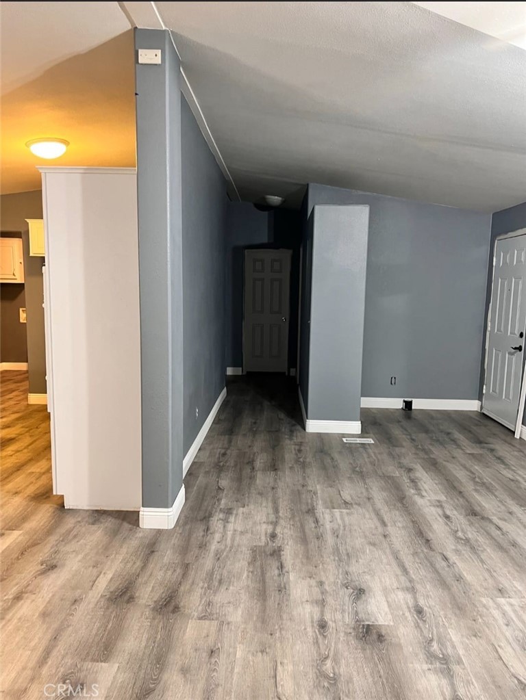 3700 Quartz Canyon Road, Unit 21 Jurupa Valley, CA 92508 - Photo 9 of 11 a view of a big room with wooden floor and brick walls