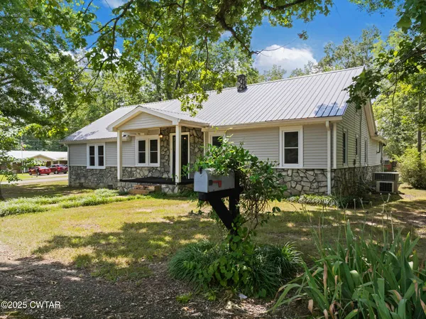 a front view of a house with swimming pool