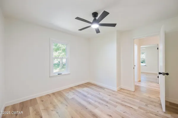 a bathroom with a double vanity sink and mirror