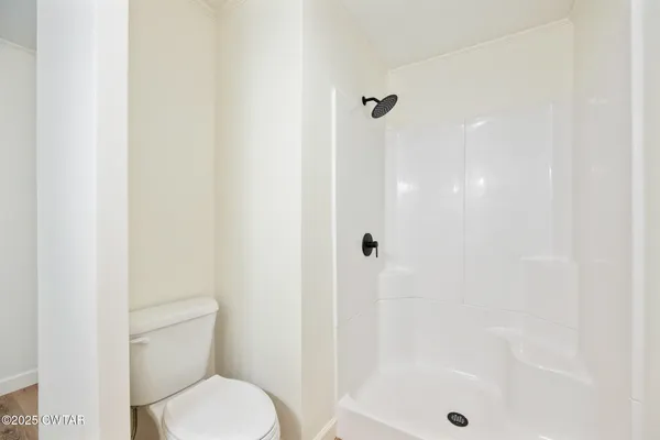 a view of a bathroom from a hallway