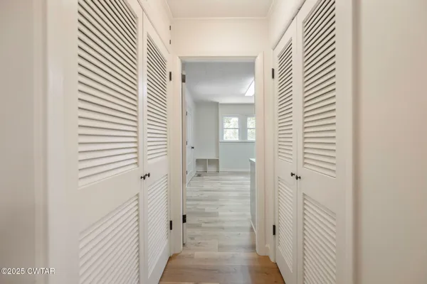 a view of a kitchen with wooden floor