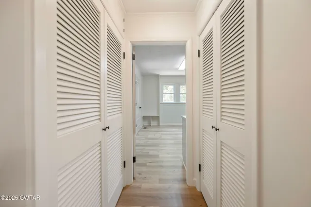 a view of a kitchen with wooden floor