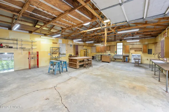 a room with table and chairs