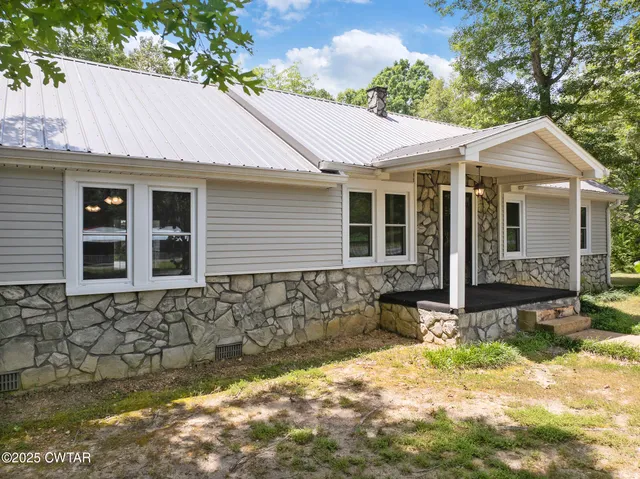 an aerial view of street and residential houses
