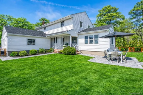 a view of a house with wooden deck