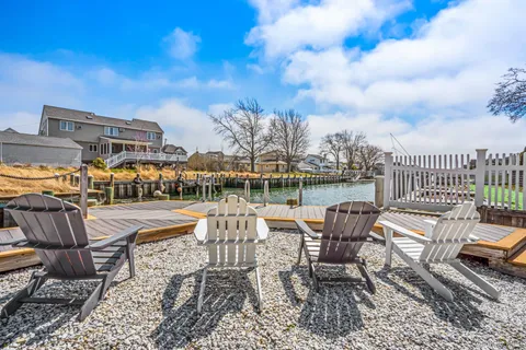 a view of a swimming pool with outdoor seating