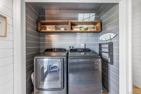 a bathroom with a sink a mirror and a shower