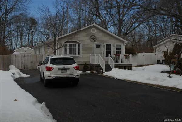 a view of a car parked in front of house