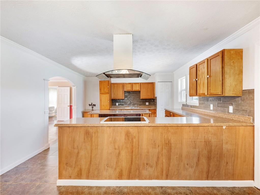1686 Shoal Creek Road Monroe, GA 30656 - Photo 7 of 50 a large white kitchen with wooden floor