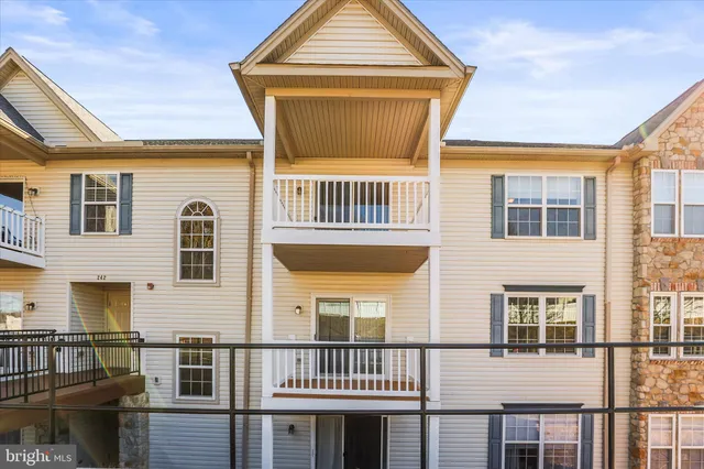 a view of a brick house with many windows