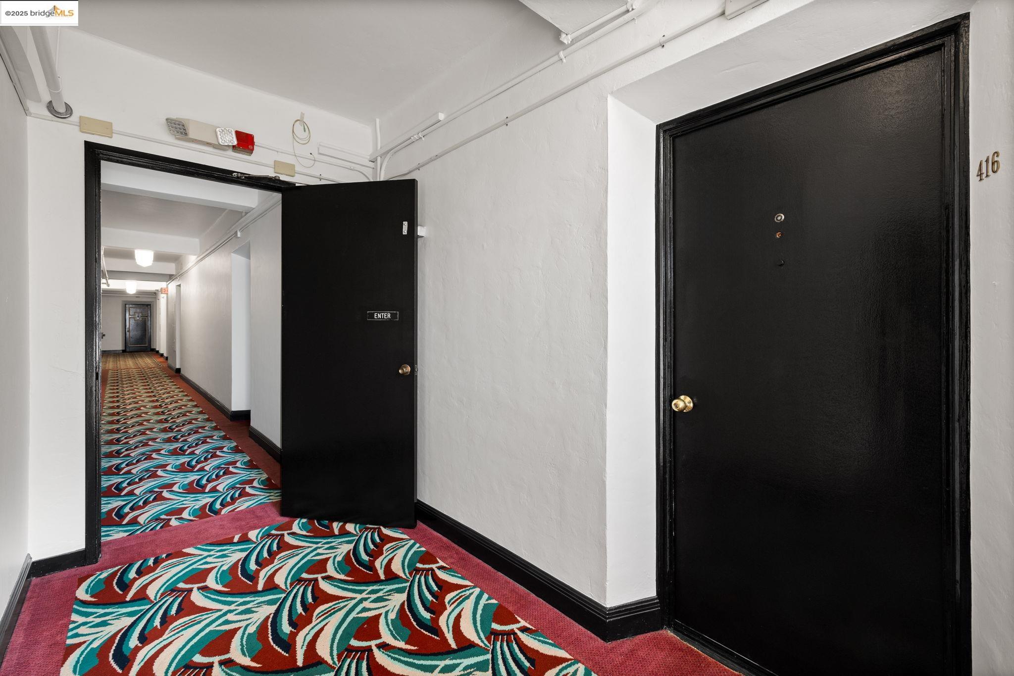 631 O'Farrell Street, Unit 416 San Francisco, CA 94109 - Photo 12 of 30 a room that has a rug and a mirror