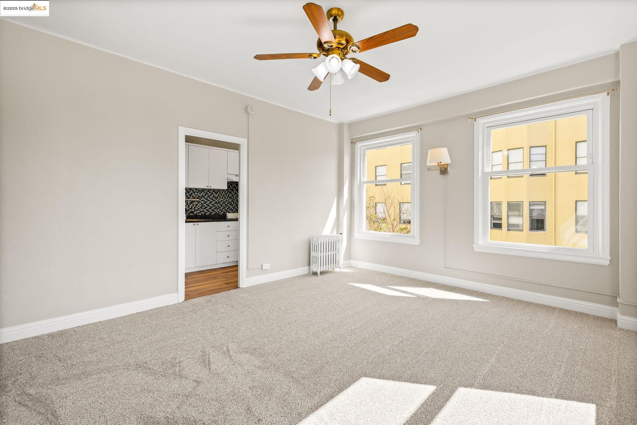 631 O'Farrell Street, Unit 416 San Francisco, CA 94109 - Photo 17 of 30 a view of a livingroom with a ceiling fan and window