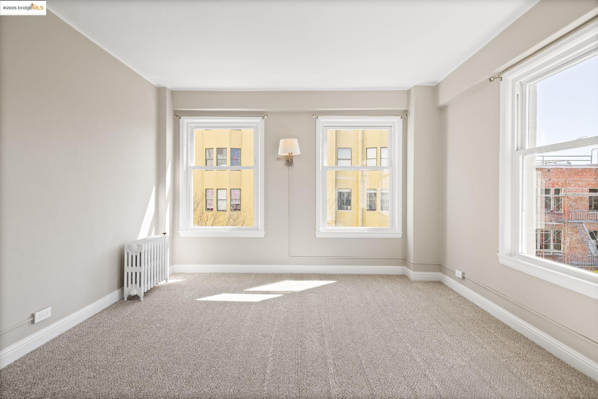631 O'Farrell Street, Unit 416 San Francisco, CA 94109 - Photo 18 of 30 an empty room with windows