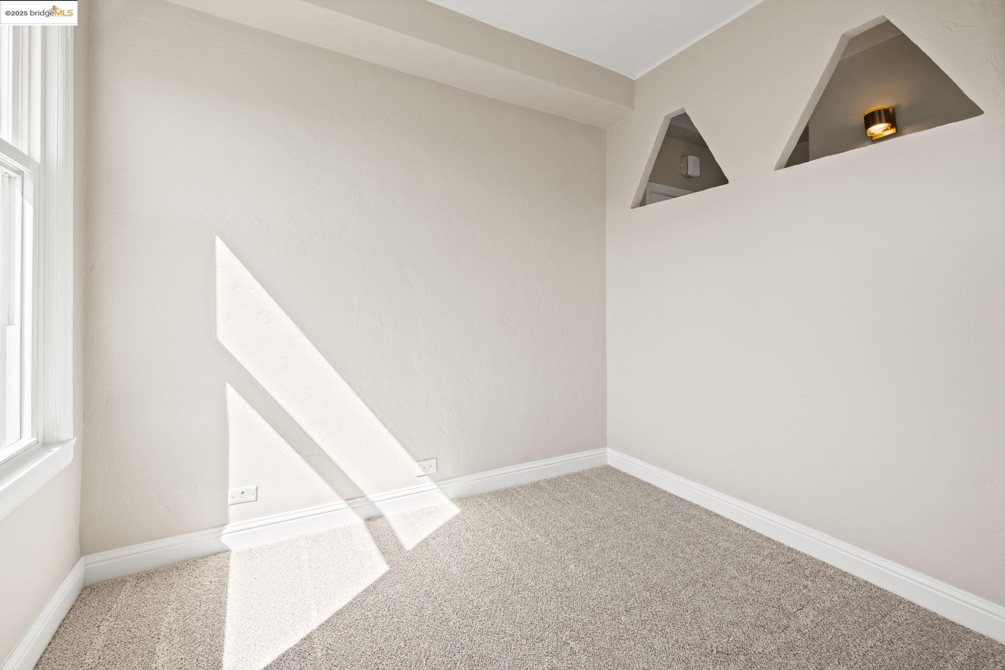 631 O'Farrell Street, Unit 416 San Francisco, CA 94109 - Photo 20 of 30 a view of a bedroom with white walls