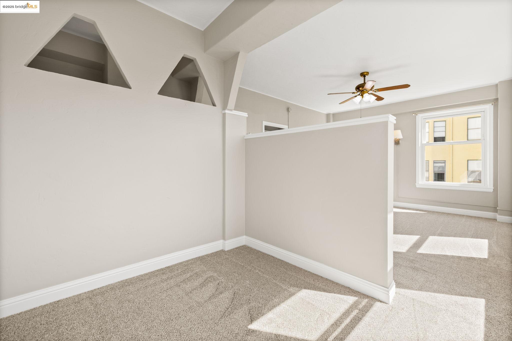 631 O'Farrell Street, Unit 416 San Francisco, CA 94109 - Photo 21 of 30 a view of an empty room with cabinet and a window