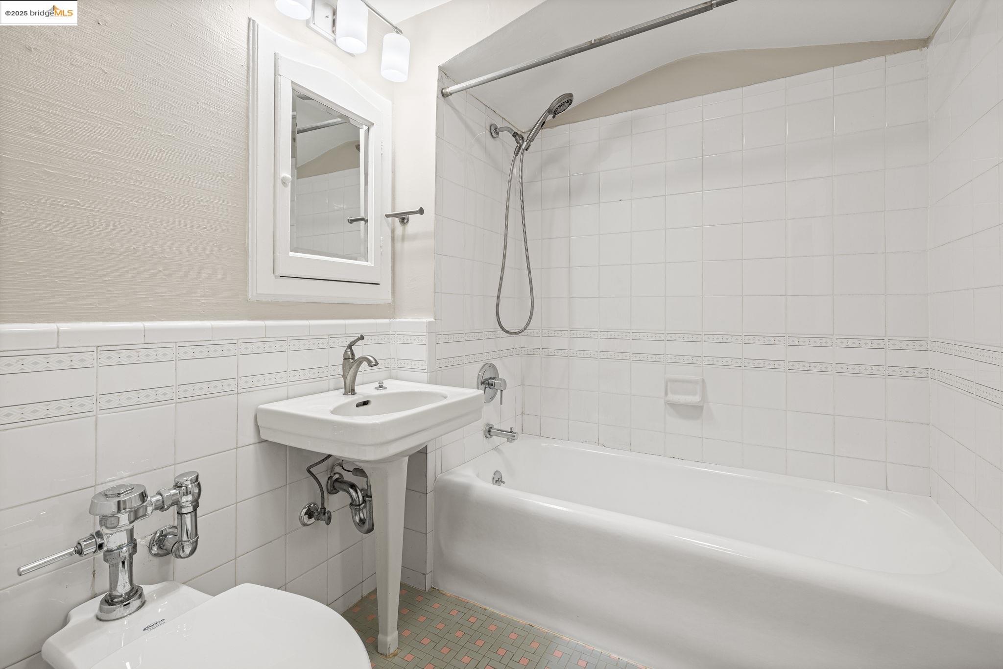 631 O'Farrell Street, Unit 416 San Francisco, CA 94109 - Photo 29 of 30 a bathroom with a sink toilet and shower