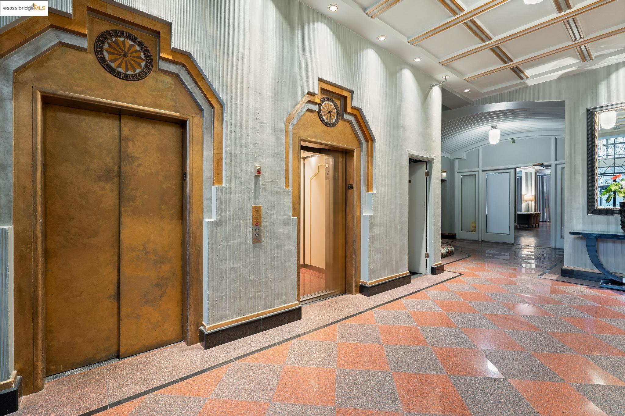 631 O'Farrell Street, Unit 416 San Francisco, CA 94109 - Photo 9 of 30 a view of a hallway with wooden shelves