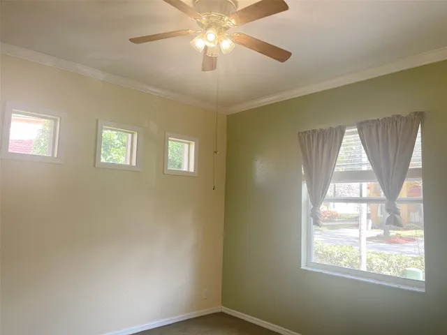 a view of an empty room with a window