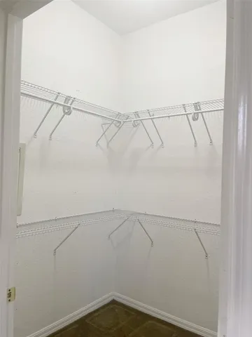 a view of an empty walk in closet