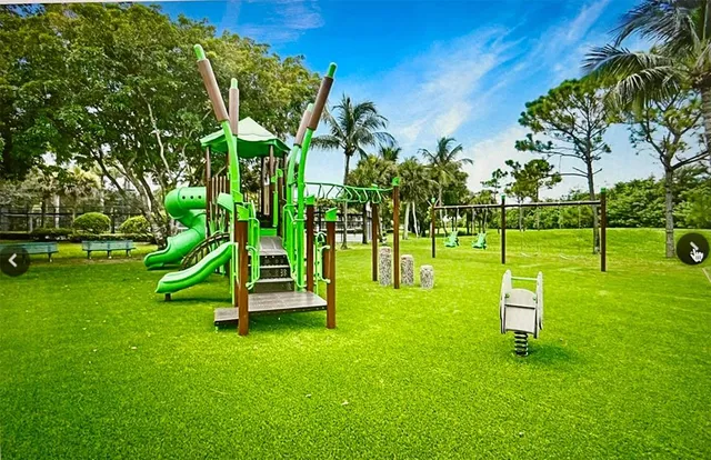 a view of a park with houses