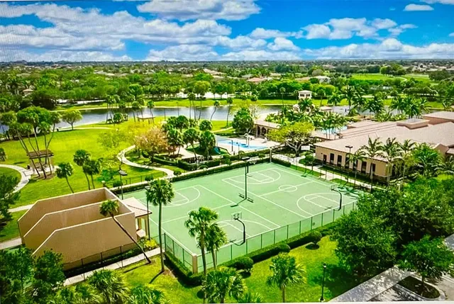 a view of a swimming pool with a yard