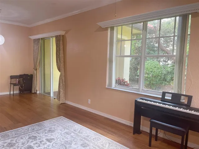 a view of a livingroom with furniture and a window
