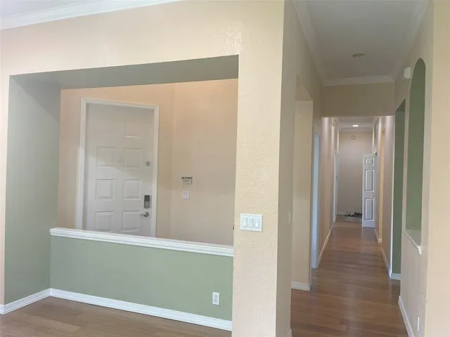 a view of a small space with wooden floor