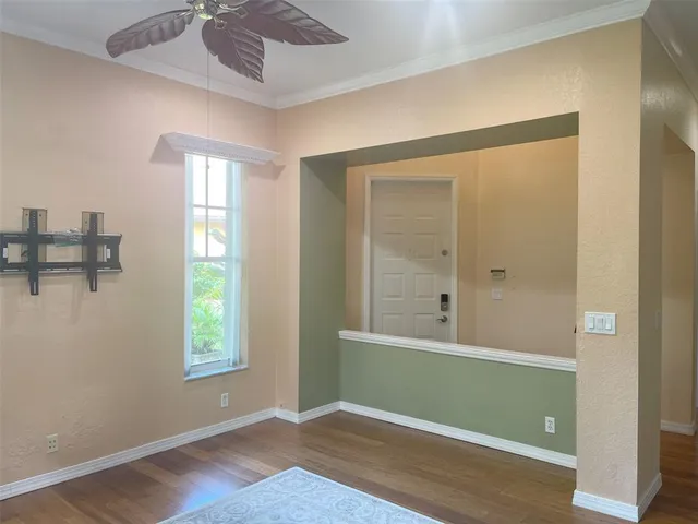 a view of room with window and hardwood floor