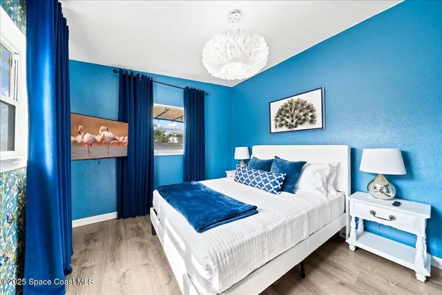 a bedroom with a bed and a lamp