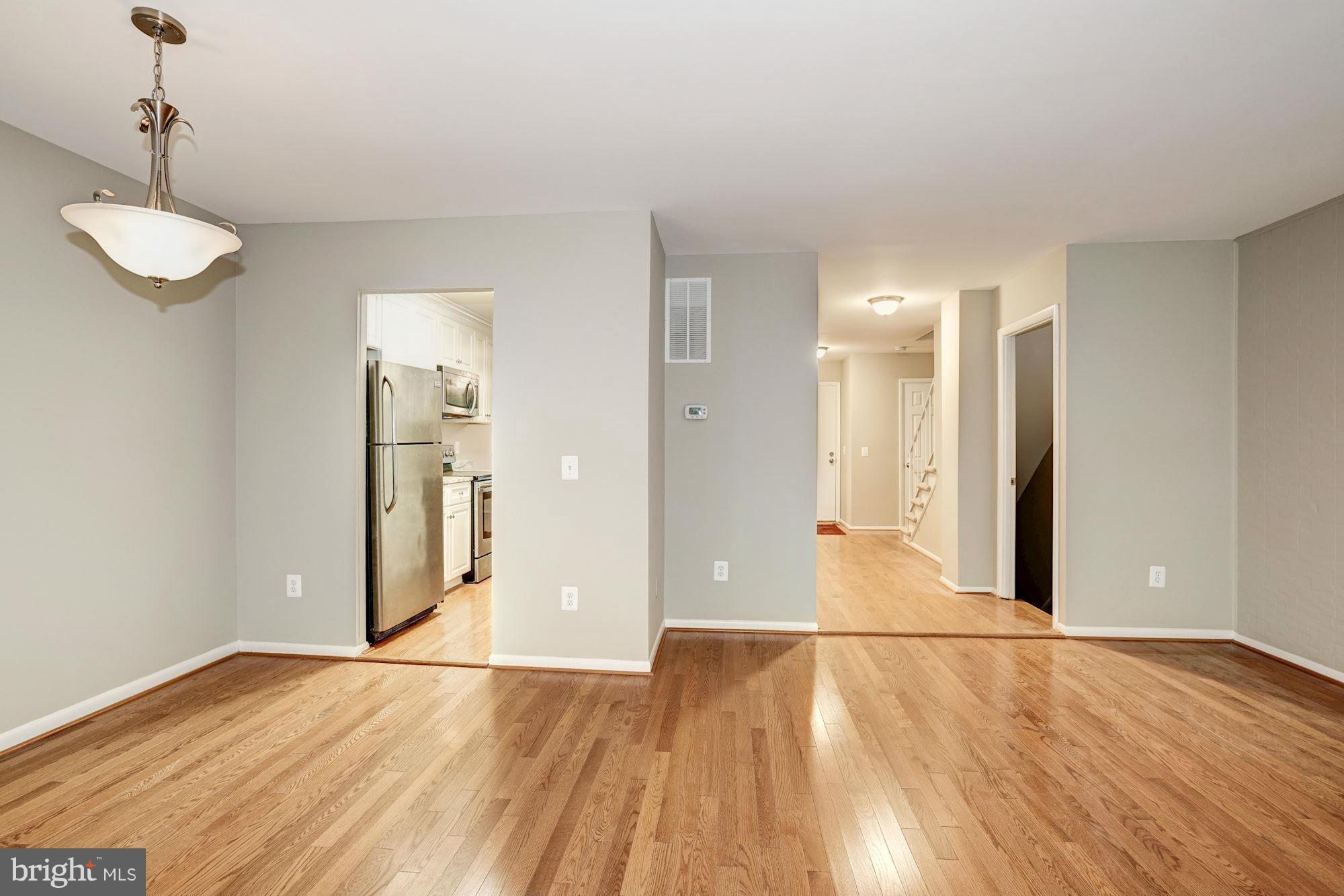 11704 Decade Court Reston, VA 20191 - Photo 16 of 30 a view of empty room with wooden floor