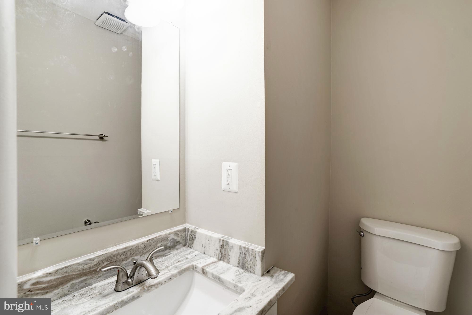 11704 Decade Court Reston, VA 20191 - Photo 17 of 30 a bathroom with a sink and a mirror