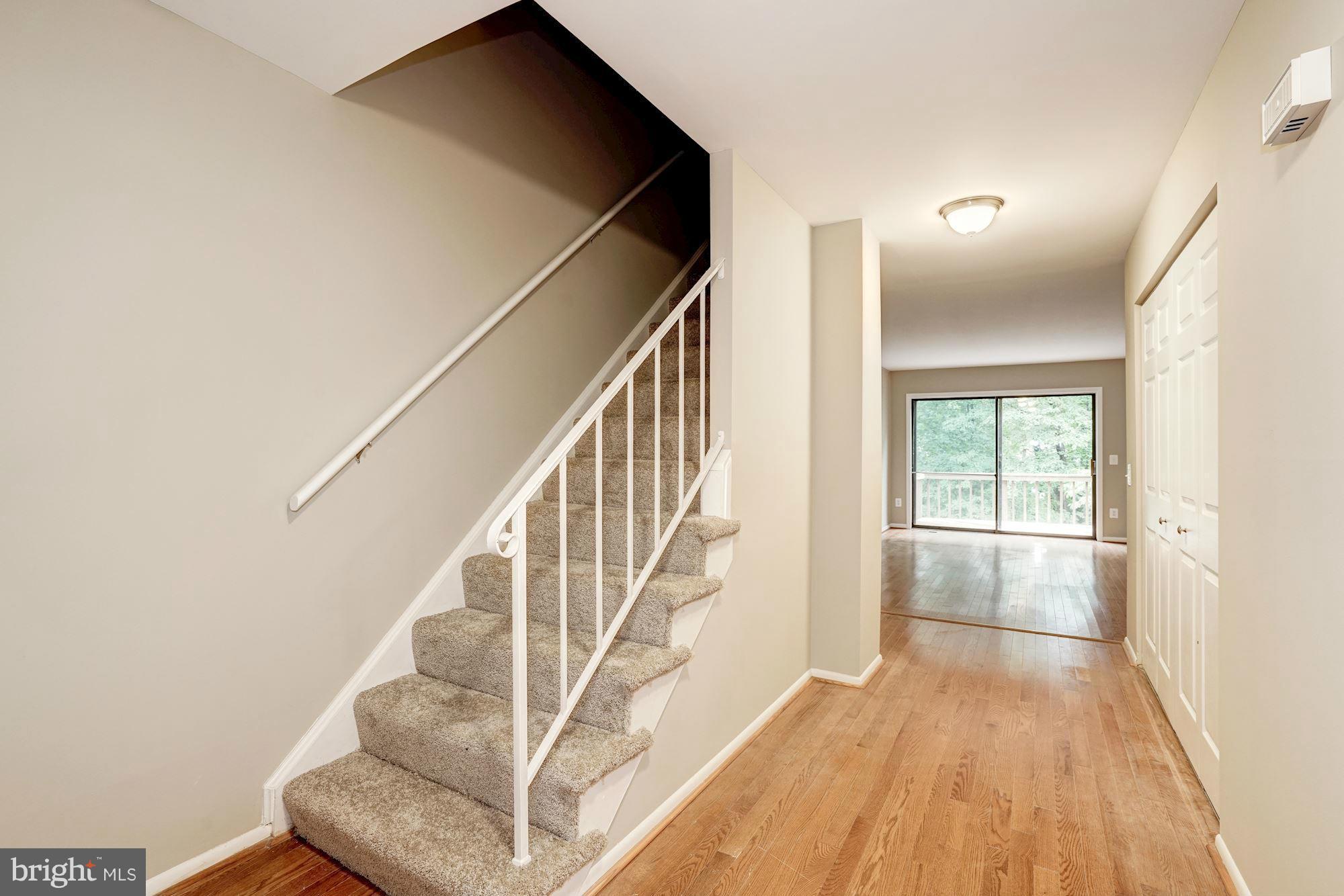 11704 Decade Court Reston, VA 20191 - Photo 3 of 30 a view of entryway and hall with wooden floor