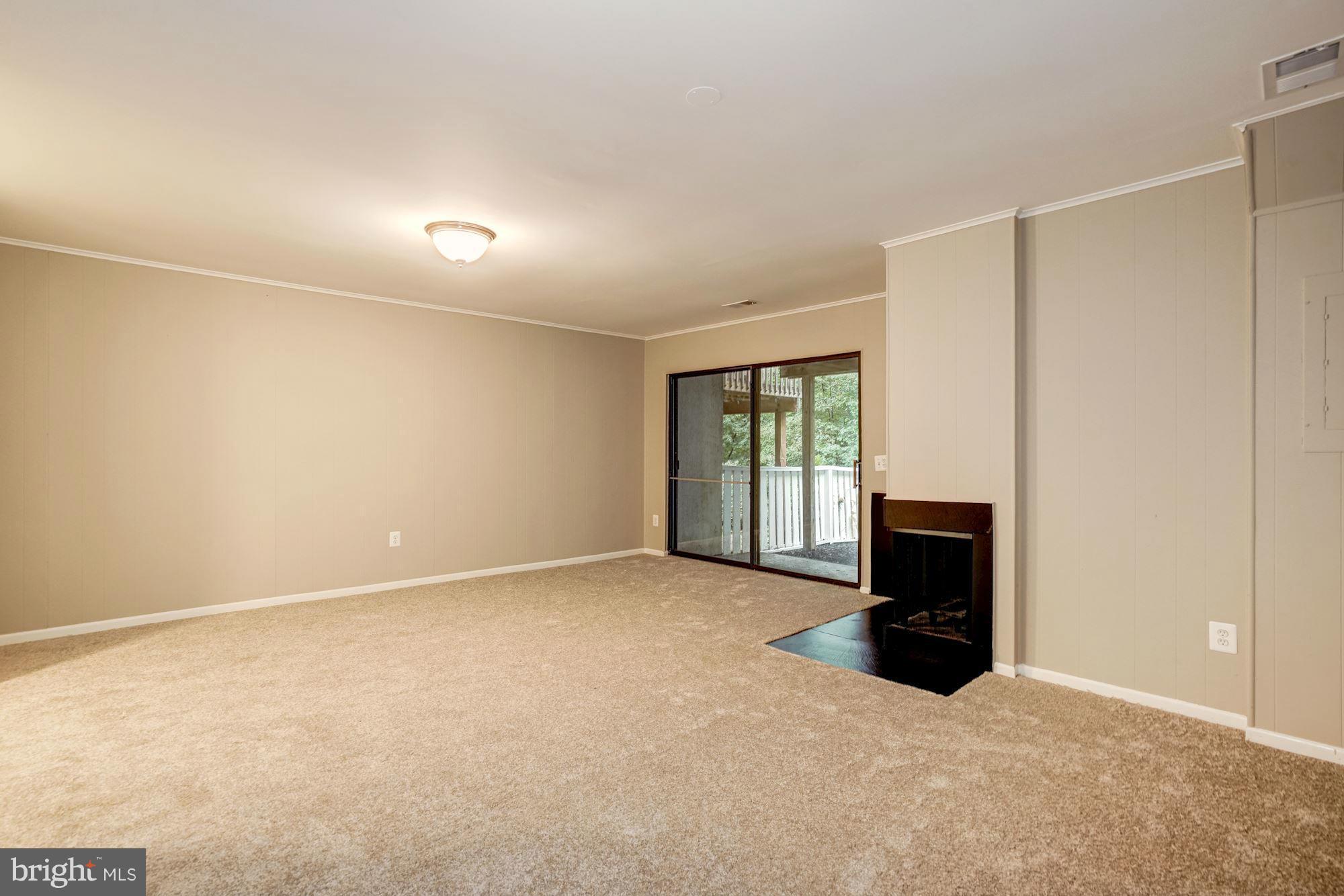 11704 Decade Court Reston, VA 20191 - Photo 24 of 30 an empty room with windows and fireplace