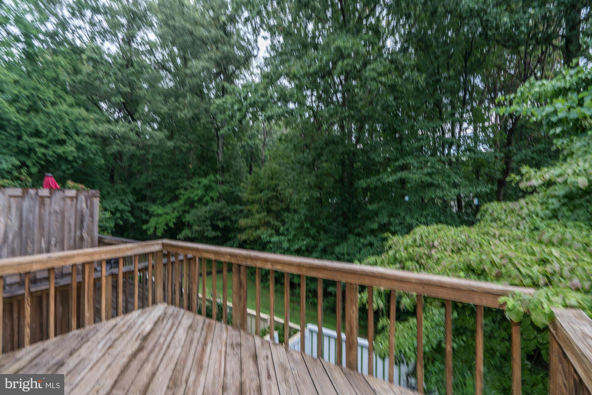 11704 Decade Court Reston, VA 20191 - Photo 30 of 30 a wooden deck with trees in front of it