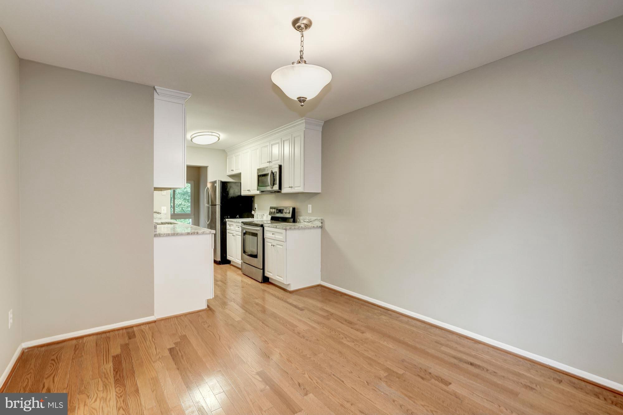 11704 Decade Court Reston, VA 20191 - Photo 4 of 30 a view of kitchen with wooden floor