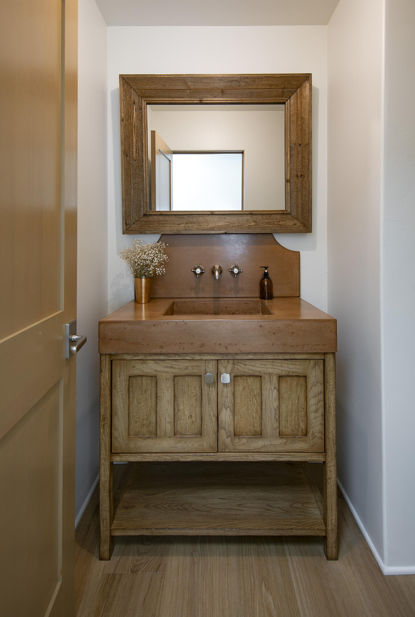 7305 Shepard Mesa Drive Carpinteria, CA 93013 - Photo 12 of 26 a bathroom with a sink and a mirror