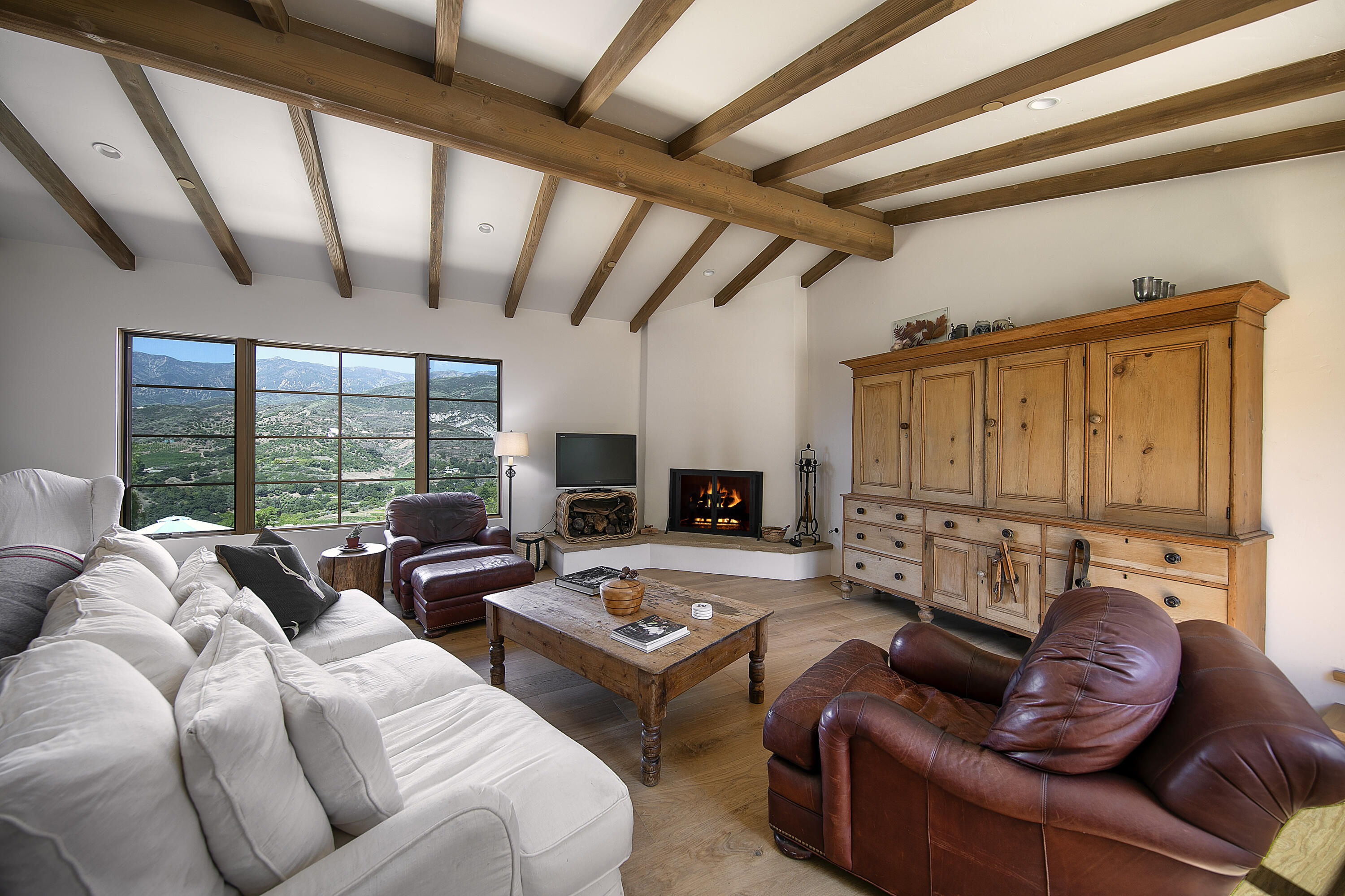 7305 Shepard Mesa Drive Carpinteria, CA 93013 - Photo 7 of 26 a living room with furniture and a large window